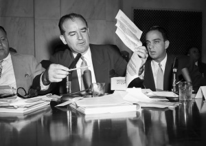 Senator Joseph McCarthy reads over the declassified recipe.